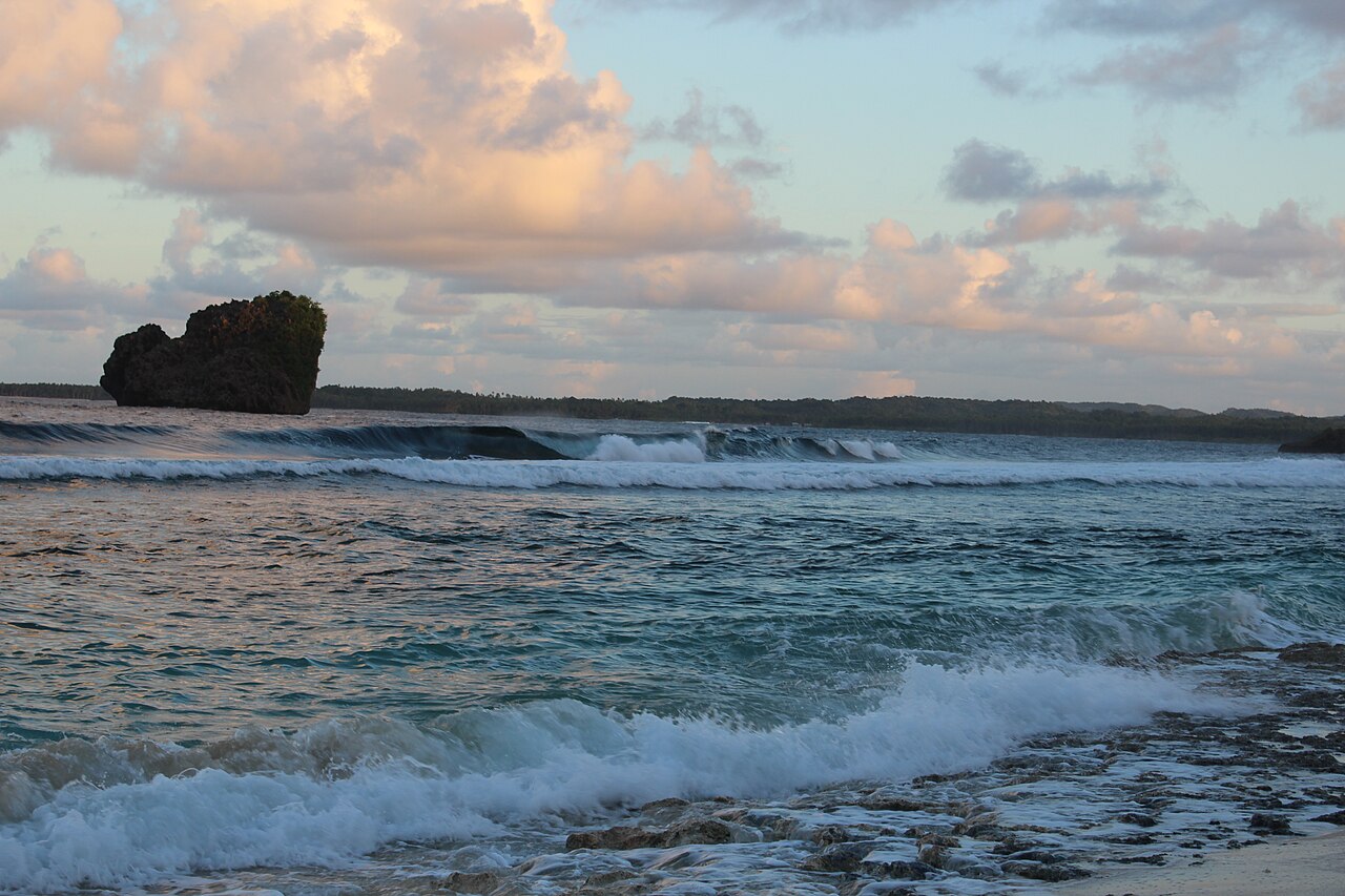 A northbound Siargao detour known for rock formations and tidal pools. Check local tide and access conditions before making the trip.